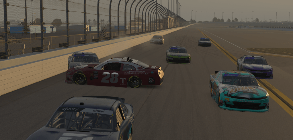 Cars racing on the track at Daytona International Speedway with one car slightly turned and in close proximity to other vehicles.
