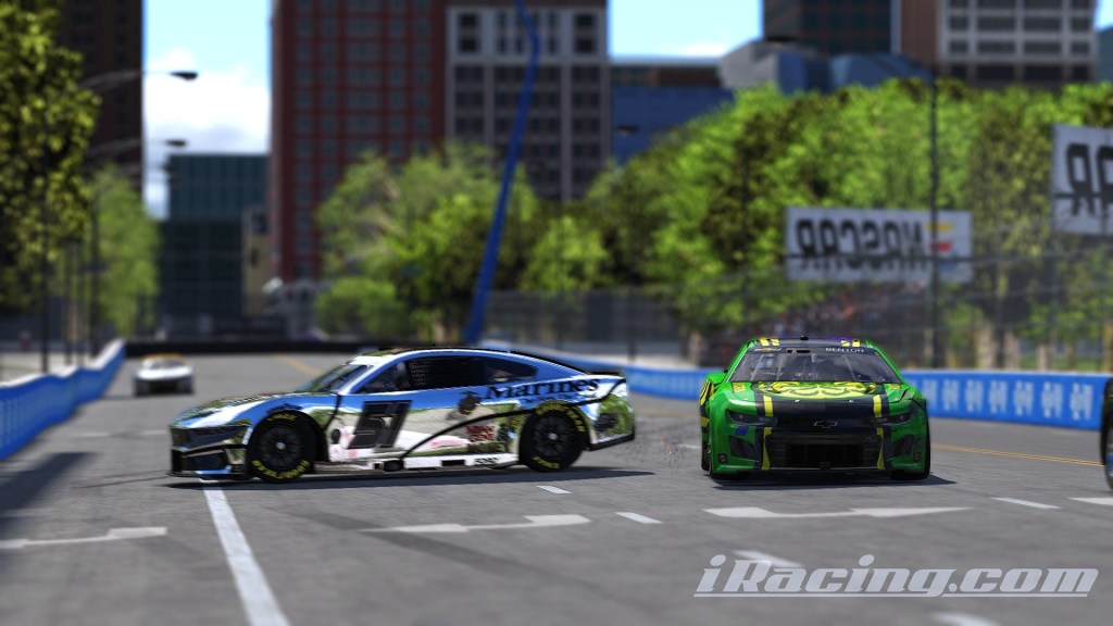 Two race cars in an urban setting during a racing event, one car is decorated with a military theme and the other features a green design.