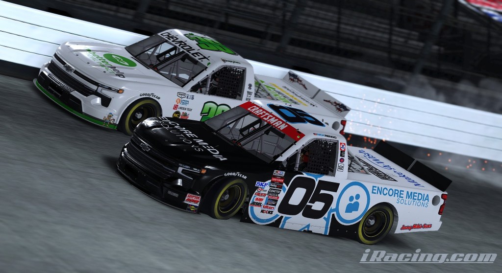 Two racing trucks competing closely on a dirt track, with one truck in black and the other in white and green, showcasing the excitement of a nighttime race.